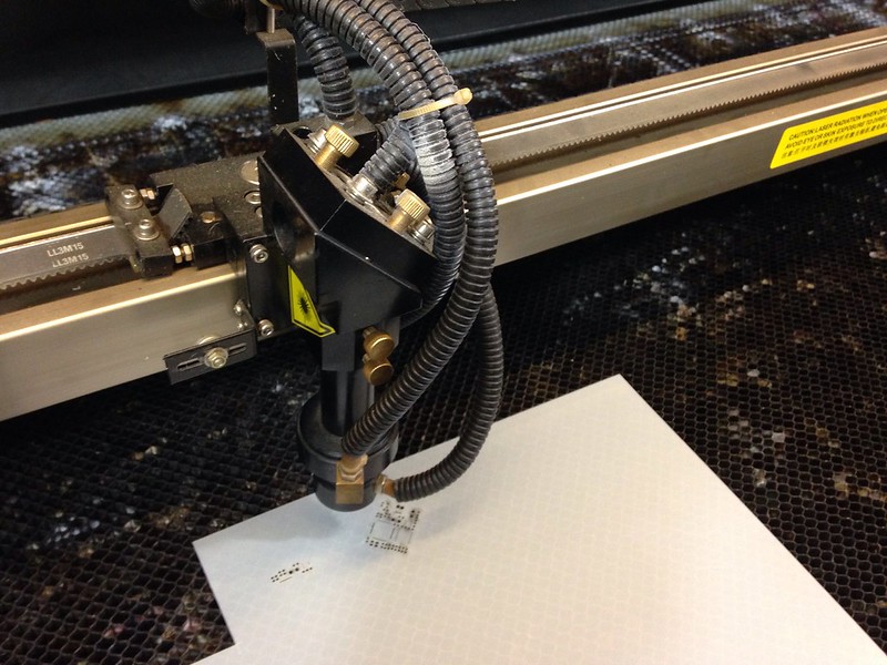 laser cutter cutting a paper sheet